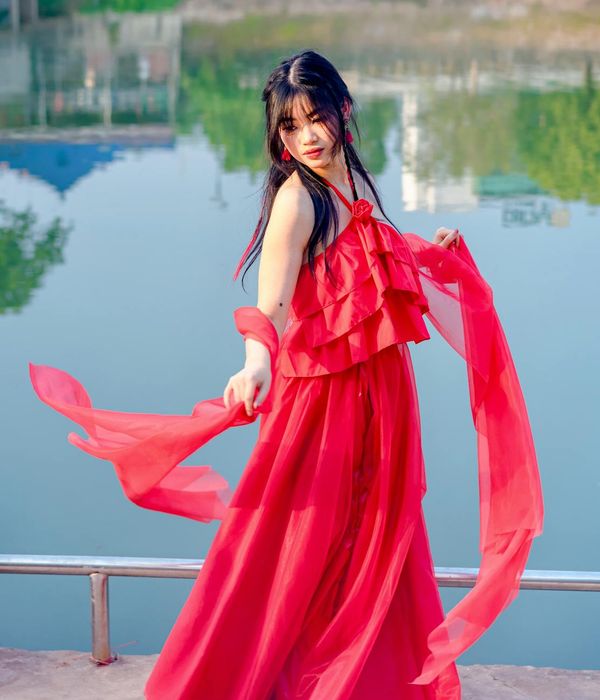 Woman feeling energetic and serene in a bright, natural setting.